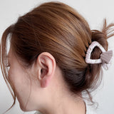 Woman wearing small pink vintage-inspired fabric claw clip by Maison Soyenne – sustainable, small & large, white, pink, black, Vintage Hair Accessories Collection